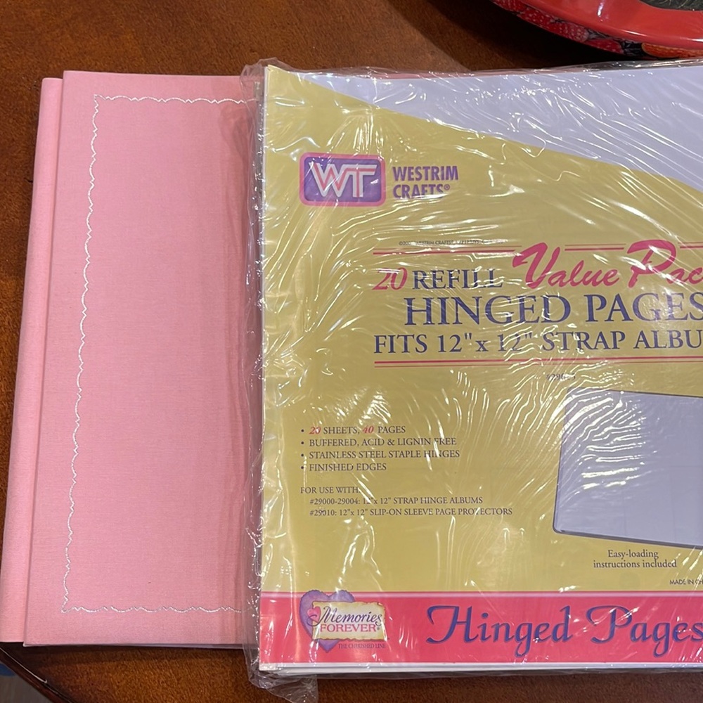 New Scrapbook with 20 extra pages and protective sheets -12”x12”